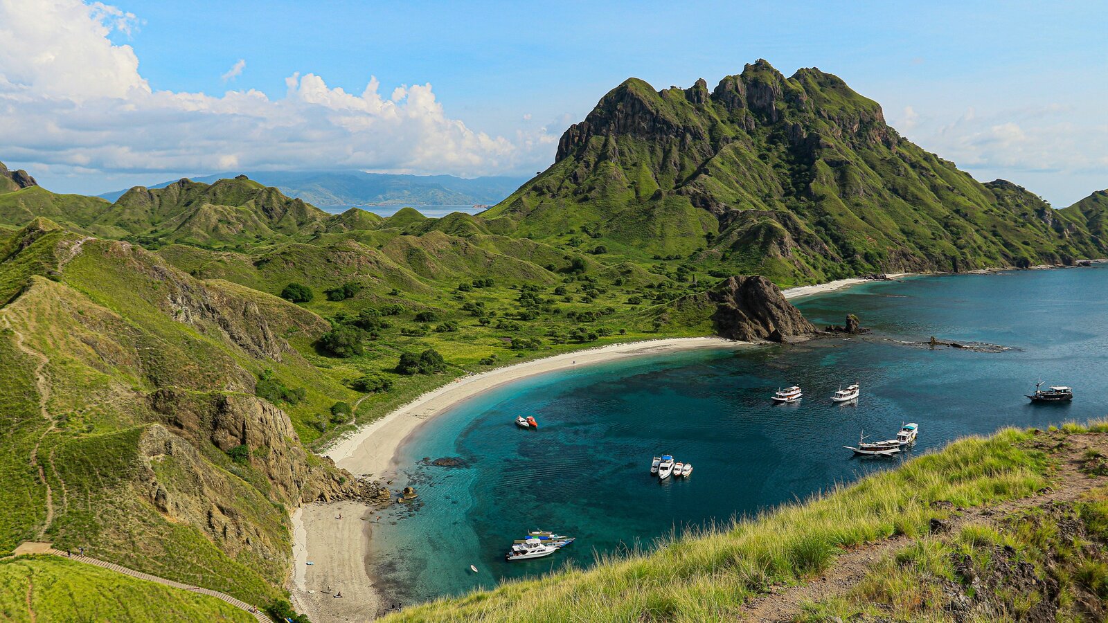 Padar Island bay with liveaboards at anchor, Komodo National Park, Indonesia