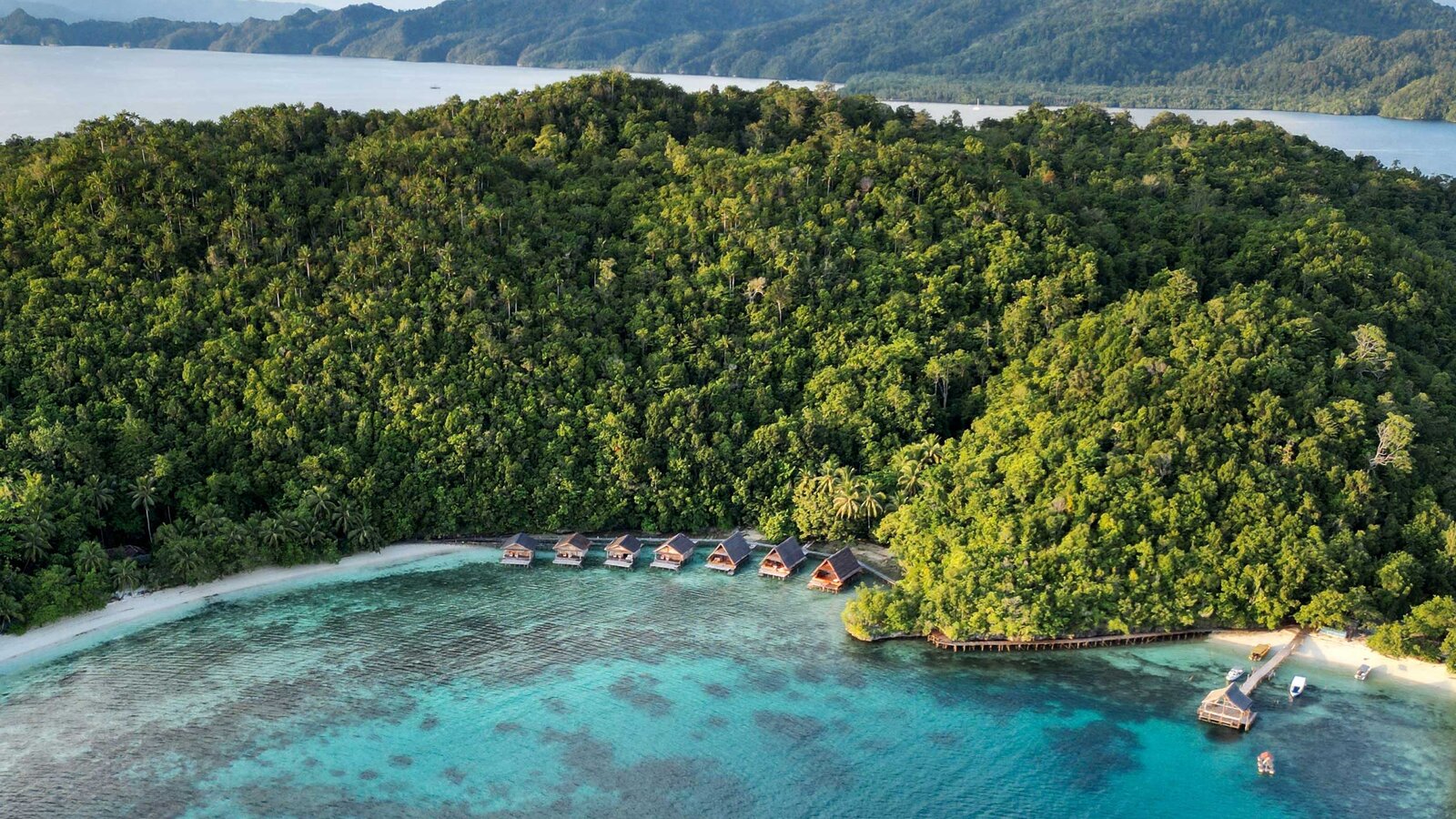 Overwater bungalows and reef, Indonesia