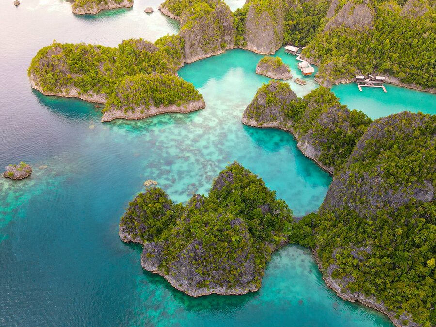 Lagoon and jetty among Raja Ampat's limestone islands, Indonesia