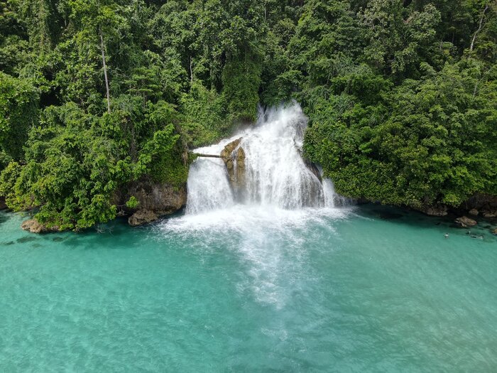Waterfall meeting the sea, Namatota and the Kumawa Coast