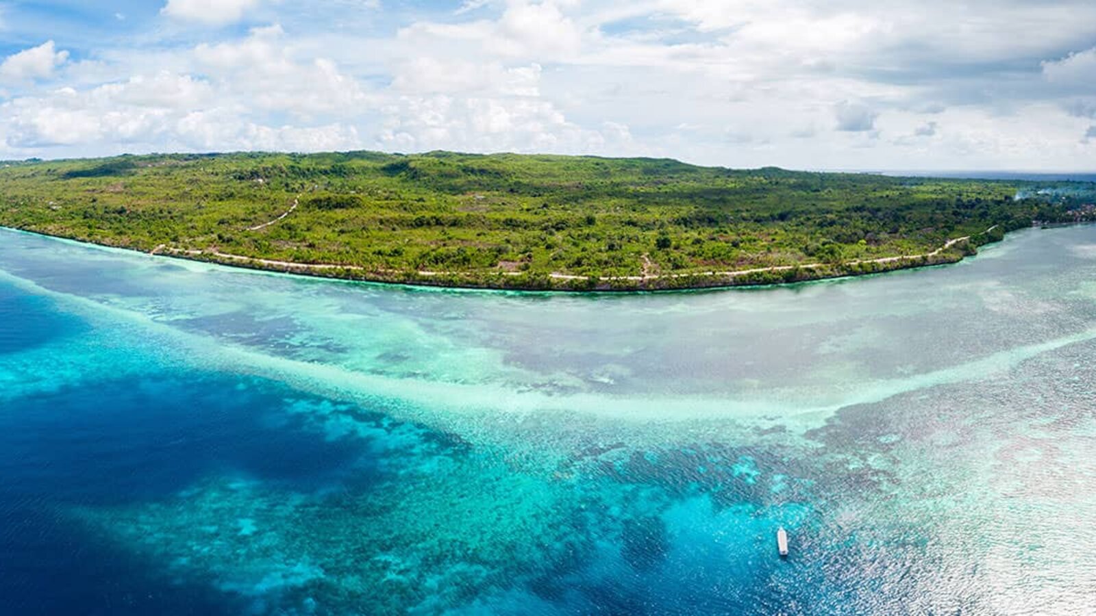Aerial panorama of reef shelf and island, Wakatobi, Indonesia